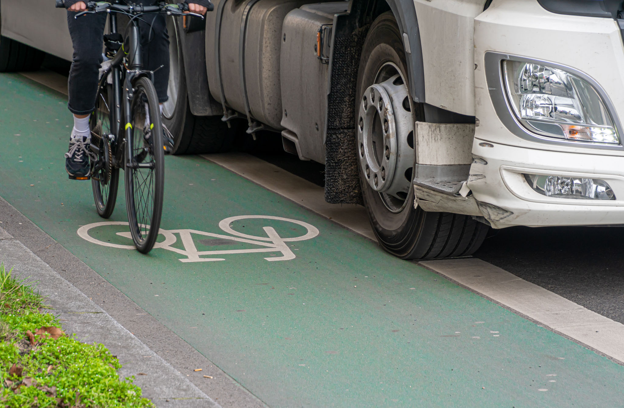 Low Section Of People Riding Bicycle